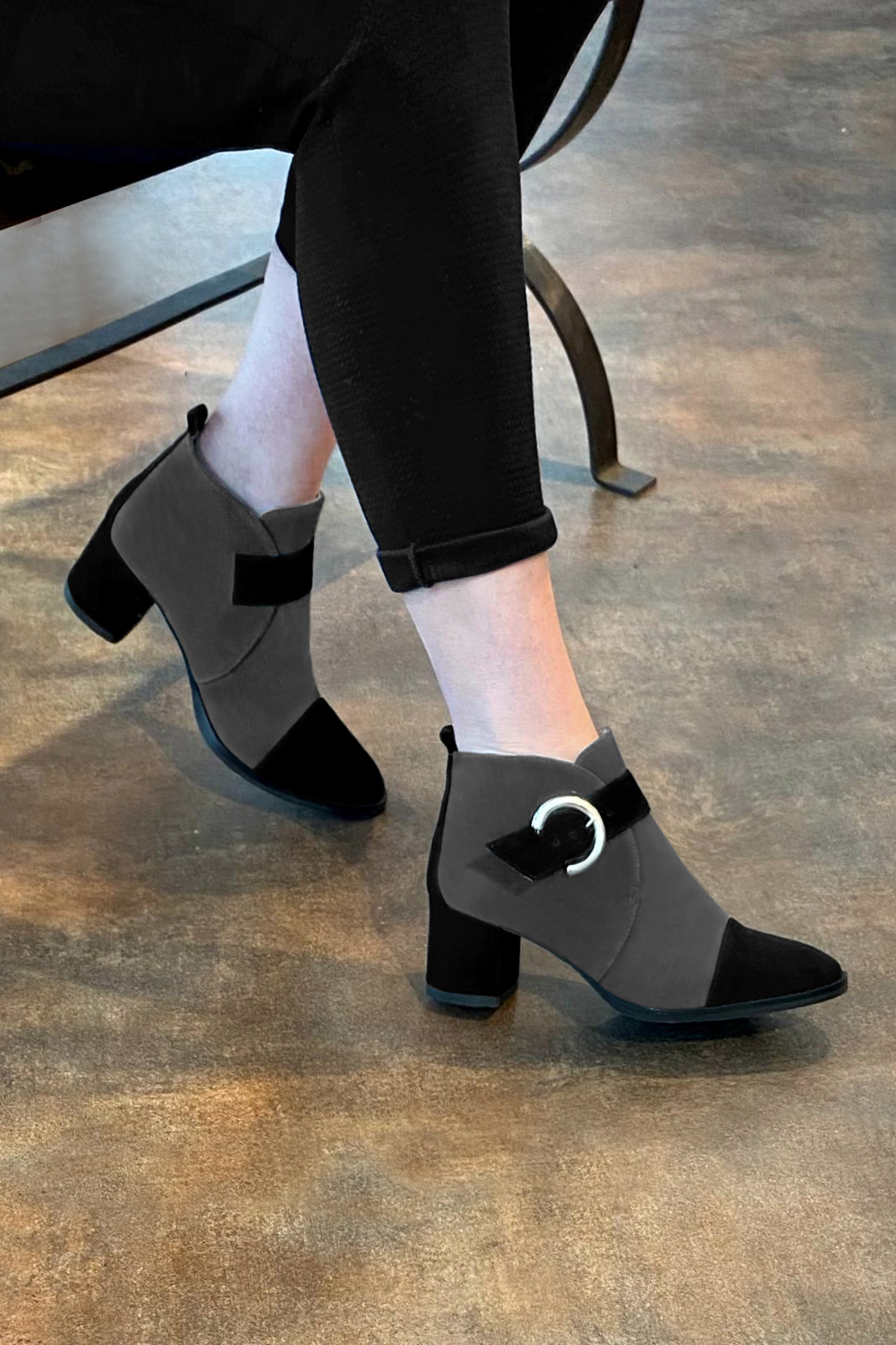 Matt black and dark grey women's ankle boots with buckles at the front. Round toe. Medium block heels. Worn view - Florence KOOIJMAN